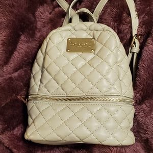 Small taupe bebe backpack.
